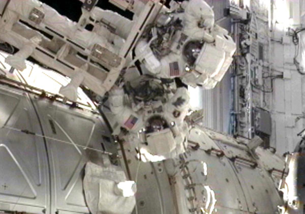 Spacewalking Astronauts Upgrade Space Station Despite Discomfort